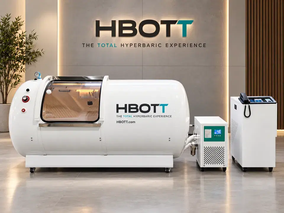 Illustrative white HBOTT-branded hard-shell chamber concept in a showroom